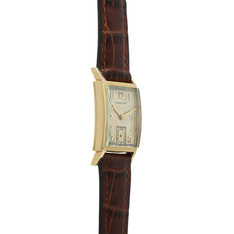 Hamilton Masonic Brock rectangular gold-tone watch with cream dial and brown leather crocodile-textured strap.