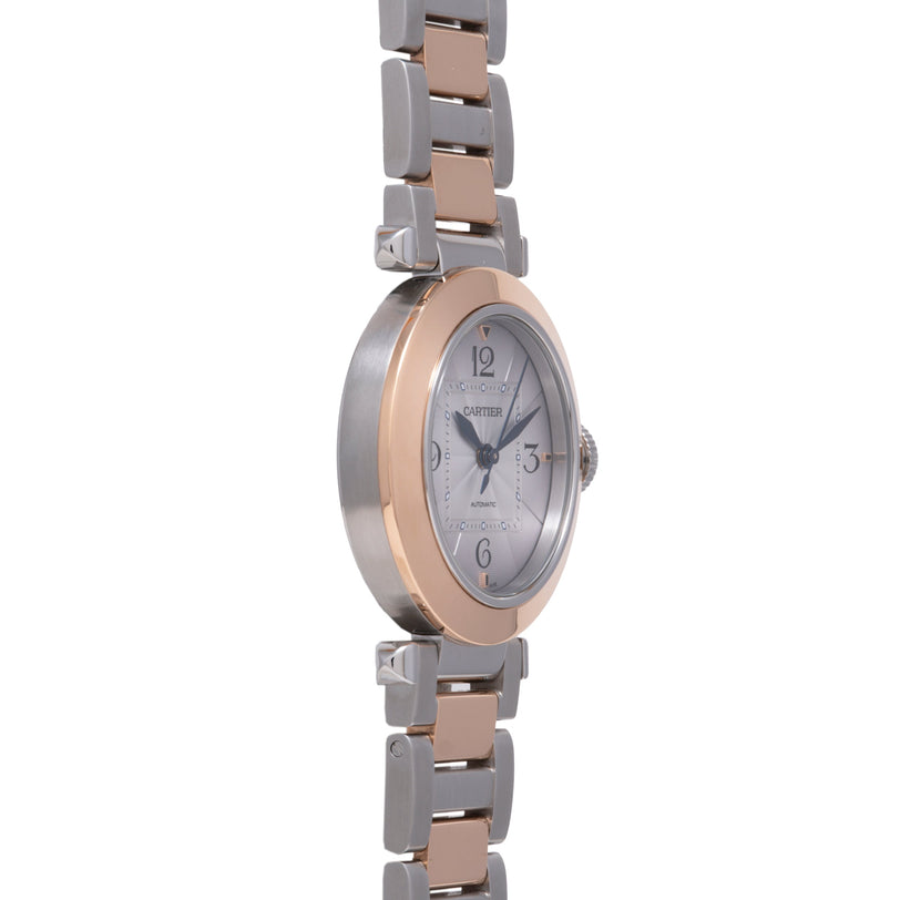 Two-tone Cartier Pasha watch with silver and rose gold case, white dial, and alternating metal bracelet links.