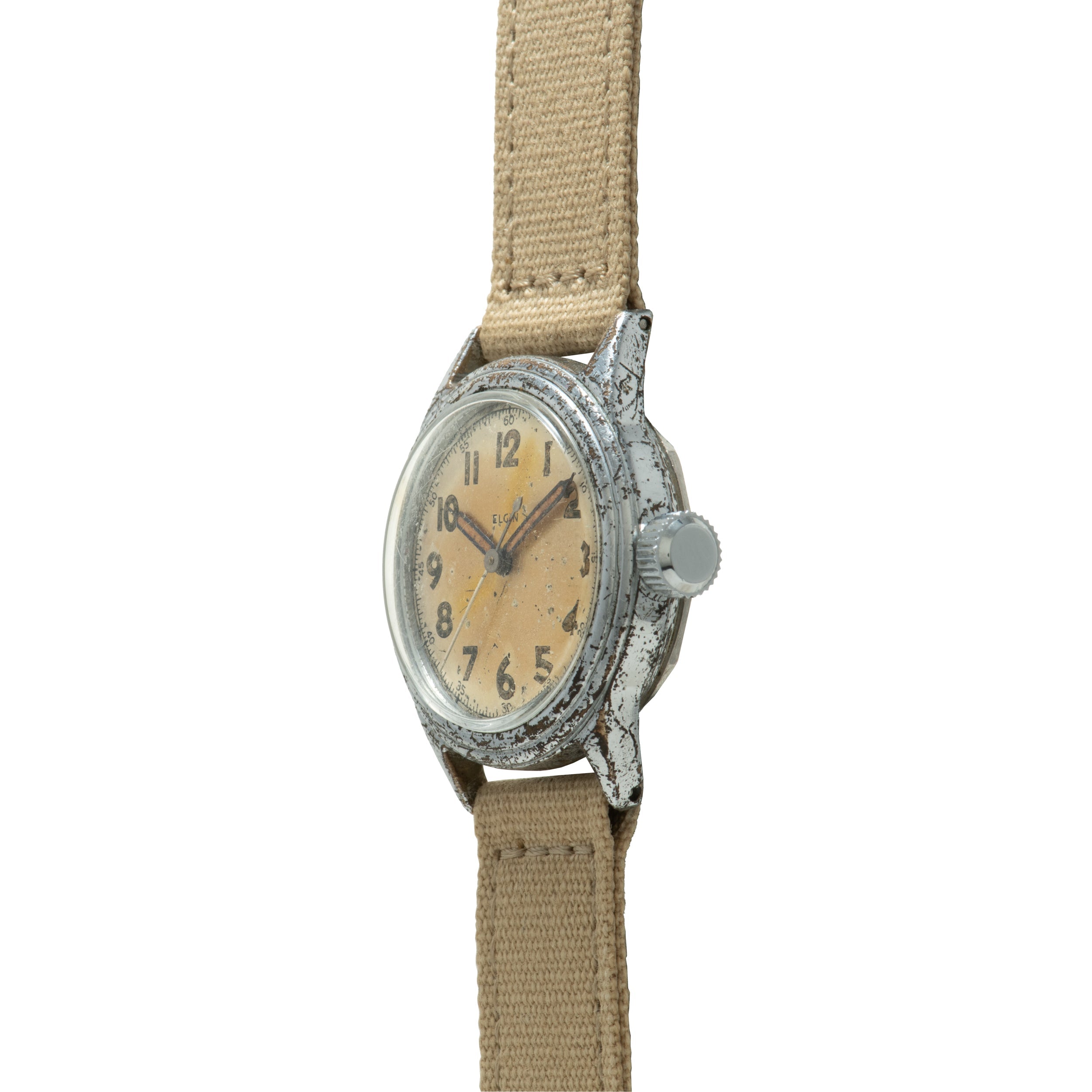 Vintage Elgin wristwatch with cream dial, Arabic numerals, weathered metal case, and tan fabric strap.