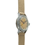 Vintage Elgin watch with patinated silver case, cream dial, Arabic numerals, and tan canvas strap.