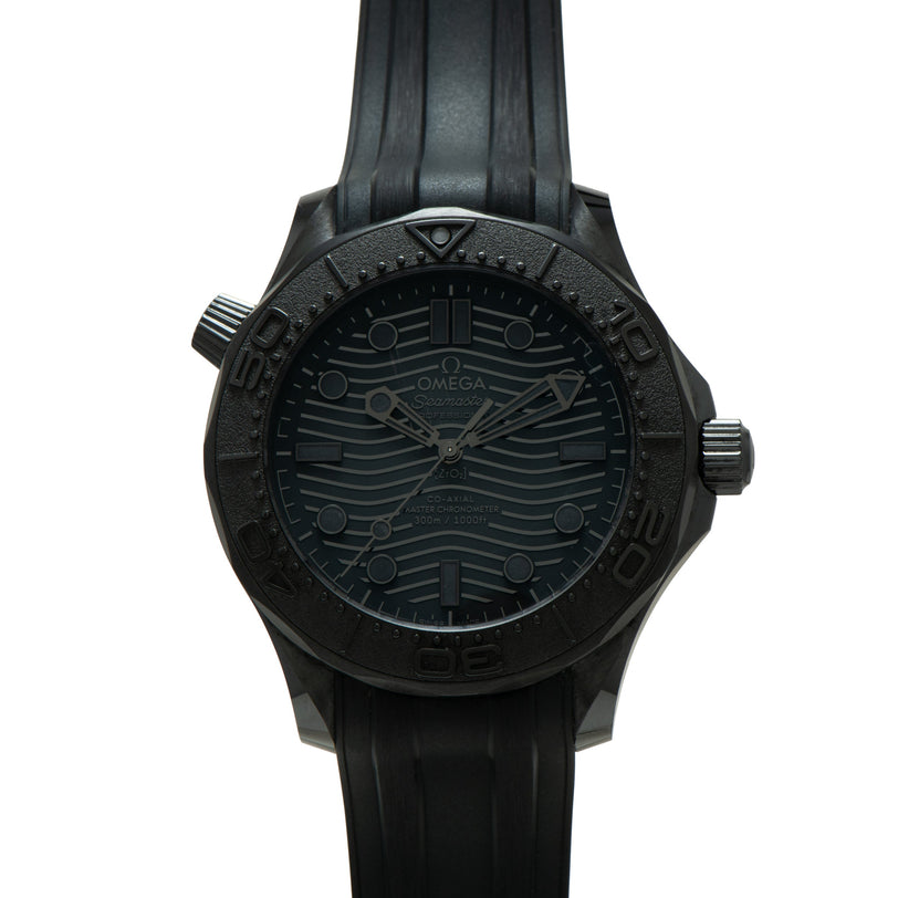 Black Omega Seamaster 300 Professional watch with wave-patterned dial, rotating bezel, and rubber strap.