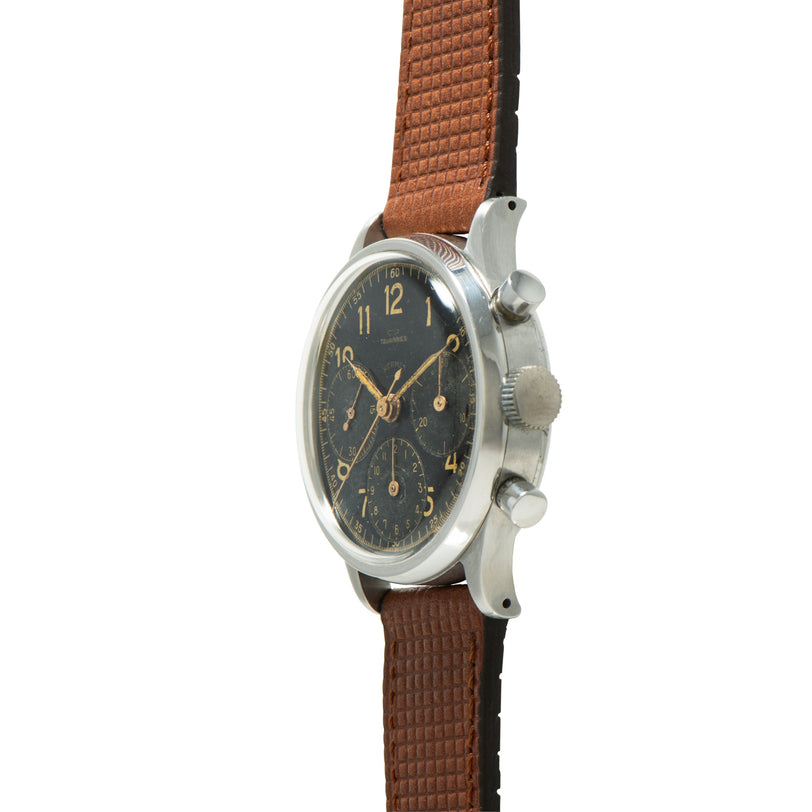 Vintage Tavannes chronograph with dark dial, gilt numerals and hands, stainless steel case, brown leather strap.