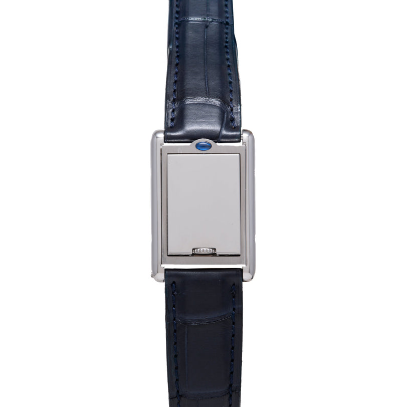 Silver-tone rectangular watch with blank dial, blue crown accent, and dark blue crocodile leather strap.