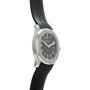 Silver-toned watch with black dial and Arabic numerals, attached to black quilted rubber strap.