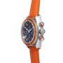 Omega Seamaster Planet Ocean chronograph watch with orange rubber strap, black dial, and orange bezel.