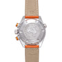 Stainless steel watch with beige and orange leather strap, visible caseback with sea creature emblem and orange pushers.