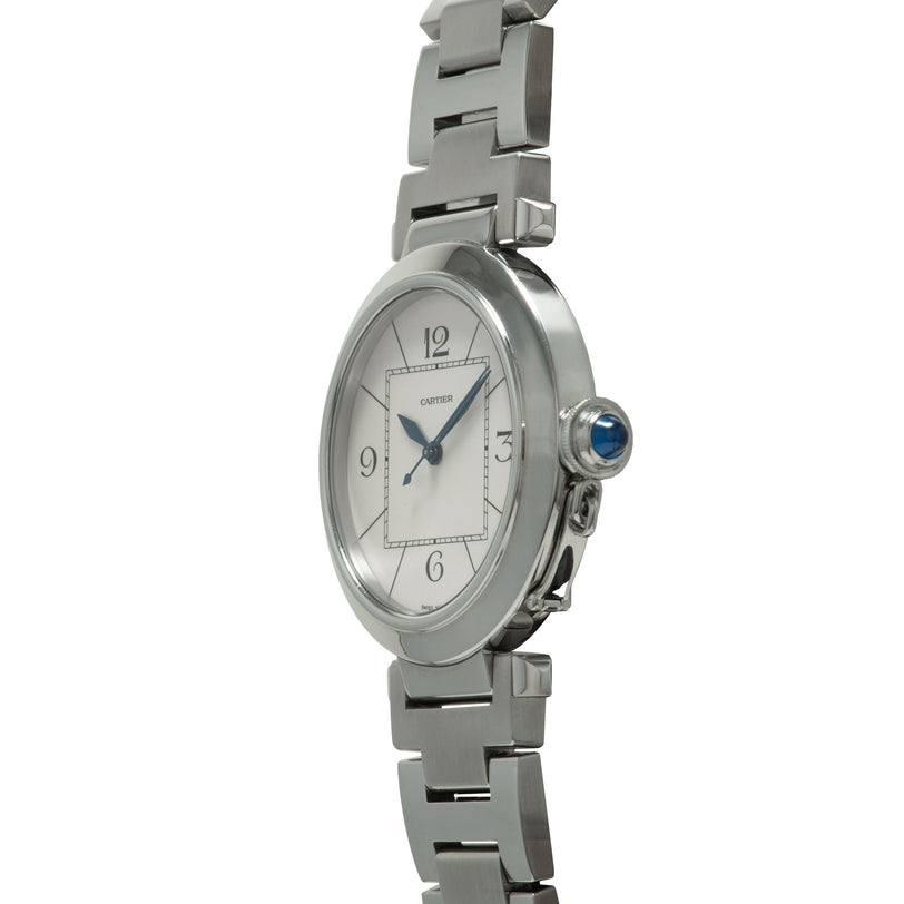 Stainless steel watch with oval white dial, Arabic numerals, blue hands, blue sapphire crown, and matching metal bracelet.