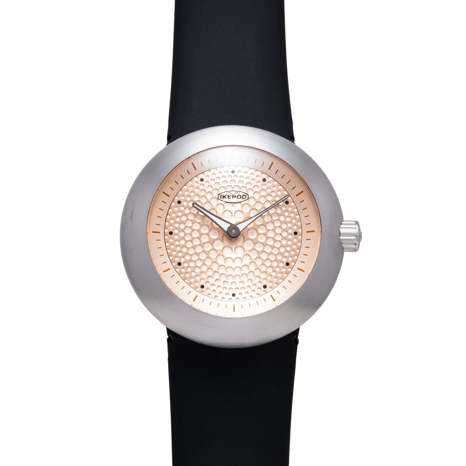 Ikepod Duopod watch with silver case, rose gold dot-patterned dial, black leather strap, and hour markers.