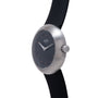 Ikepod Duopod Dots 004 watch with brushed steel case, black dial with orange dot indices, and black rubber strap.