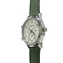 Silver-tone watch with cream dial, dual time zones marked "Local" and "Home," and green textile strap.