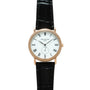 Patek Philippe Calatrava watch with rose gold case, white dial, Roman numerals, and black leather strap.