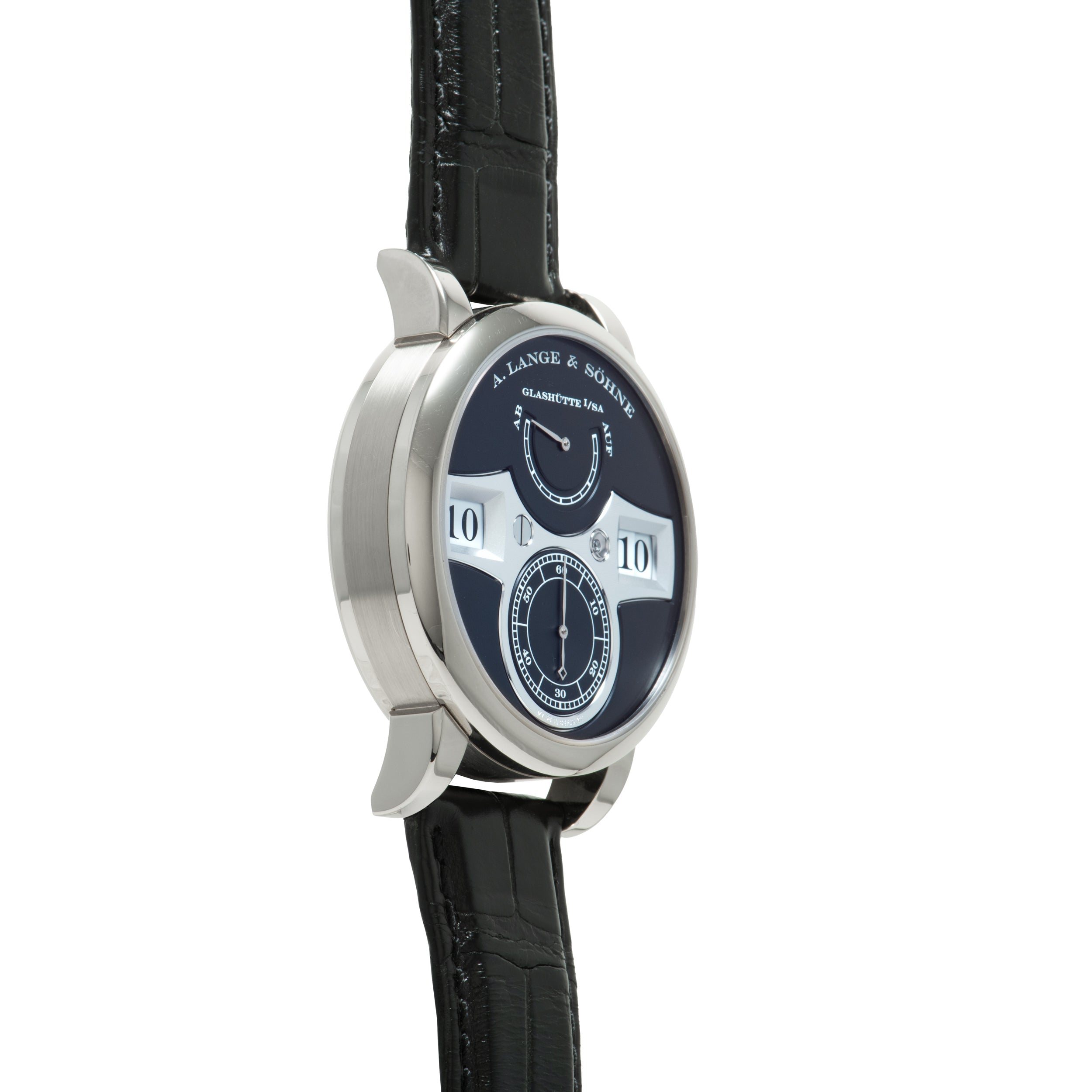 Silver-cased watch with dark blue dial, white jumping hour numerals, subsidiary dials, and black leather strap.