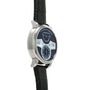 Silver-cased watch with dark blue dial, white jumping hour numerals, subsidiary dials, and black leather strap.