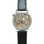 Silver-tone watch with exposed mechanical movement, blue leather strap, and visible gears and jewels on dial.