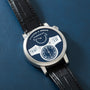 Silver-cased watch with dark blue dial, white digit displays showing "10", and small subdial, paired with black crocodile lea