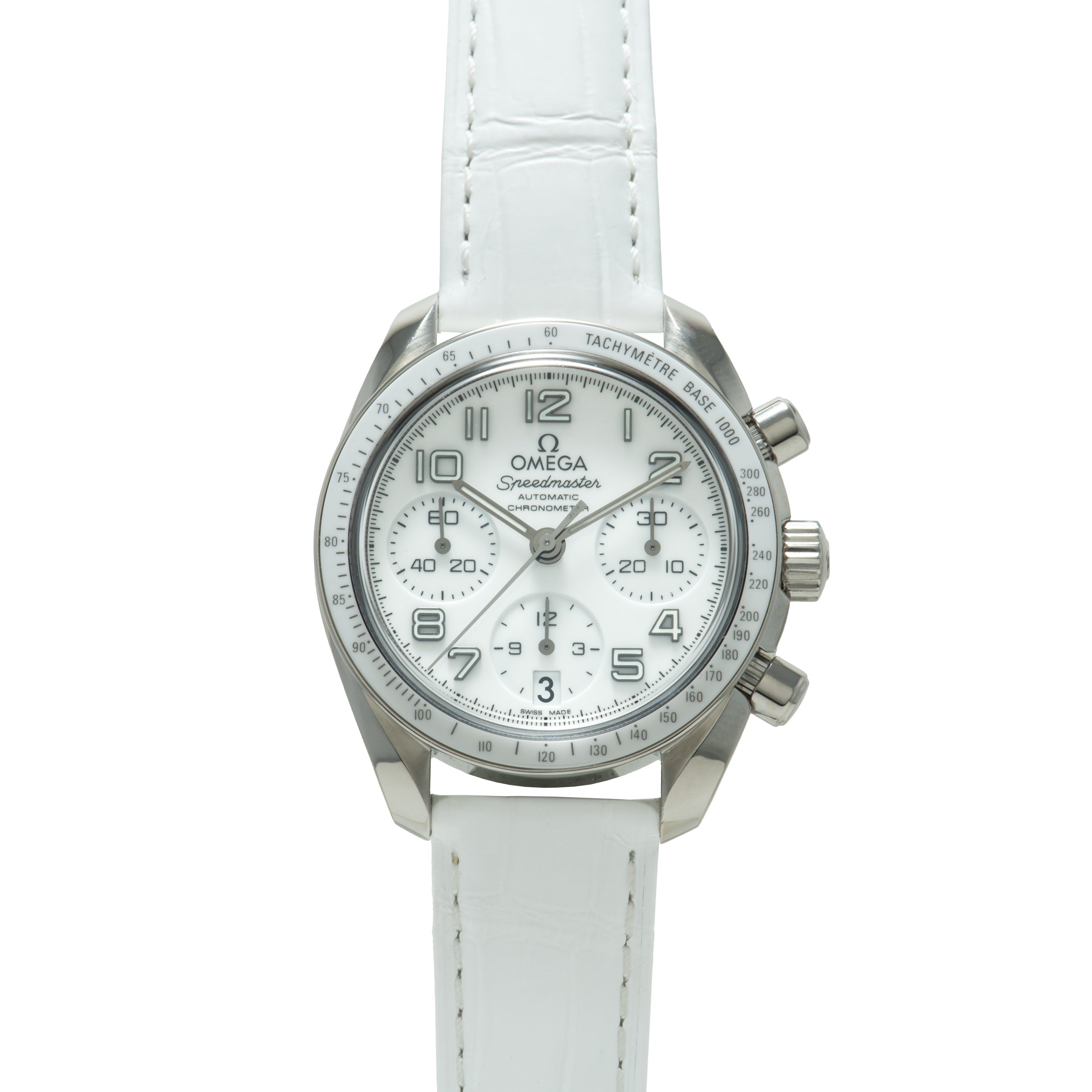 Stainless steel chronograph watch with white dial, tachymetre bezel, and white leather strap.