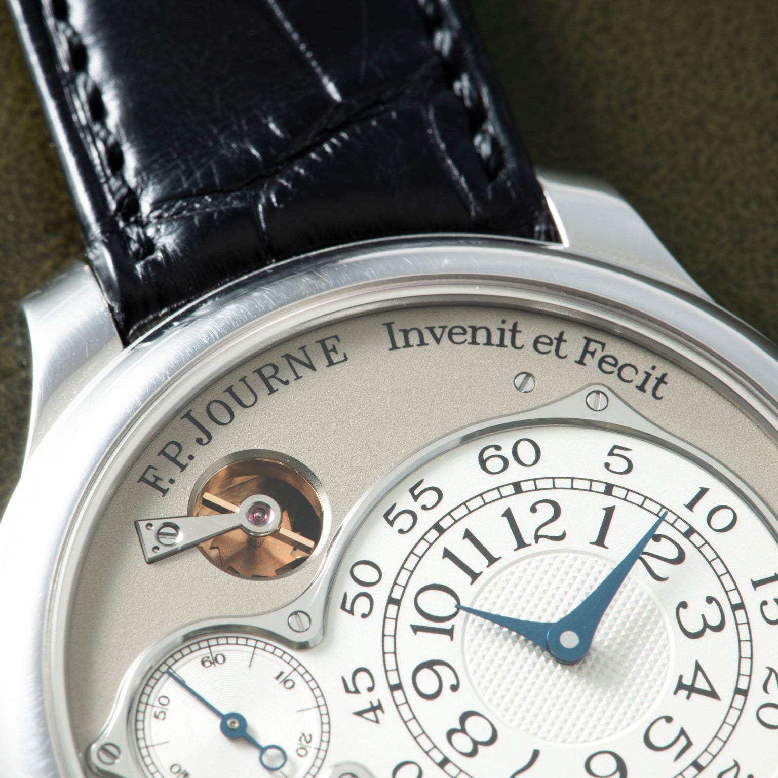 F.P. Journe Chronomètre Optimum watch with silver case, cream dial, blue hands, power reserve indicator, and black leather st
