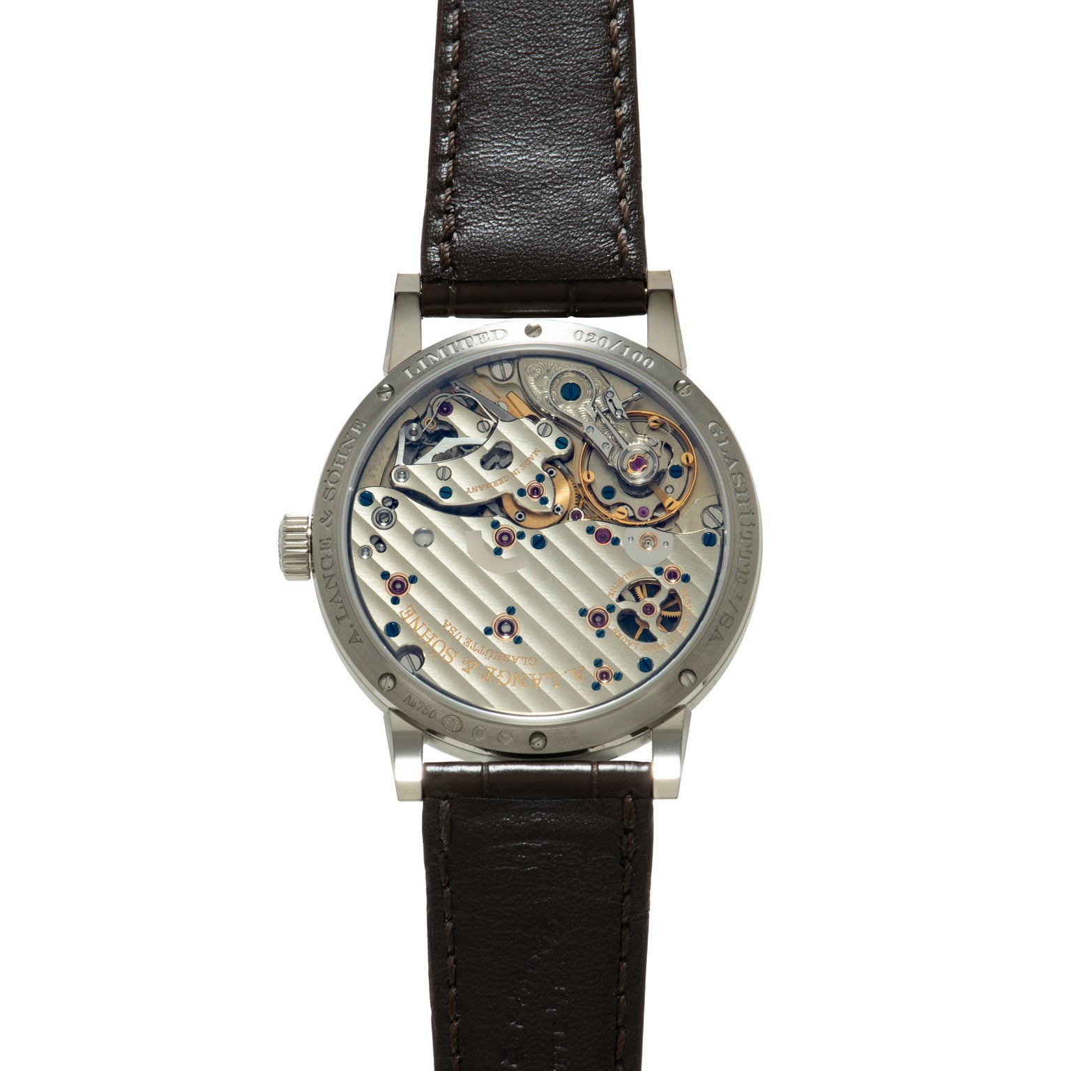 Silver-cased watch with exposed mechanical movement, black leather strap, and visible gears and jewels on dial.