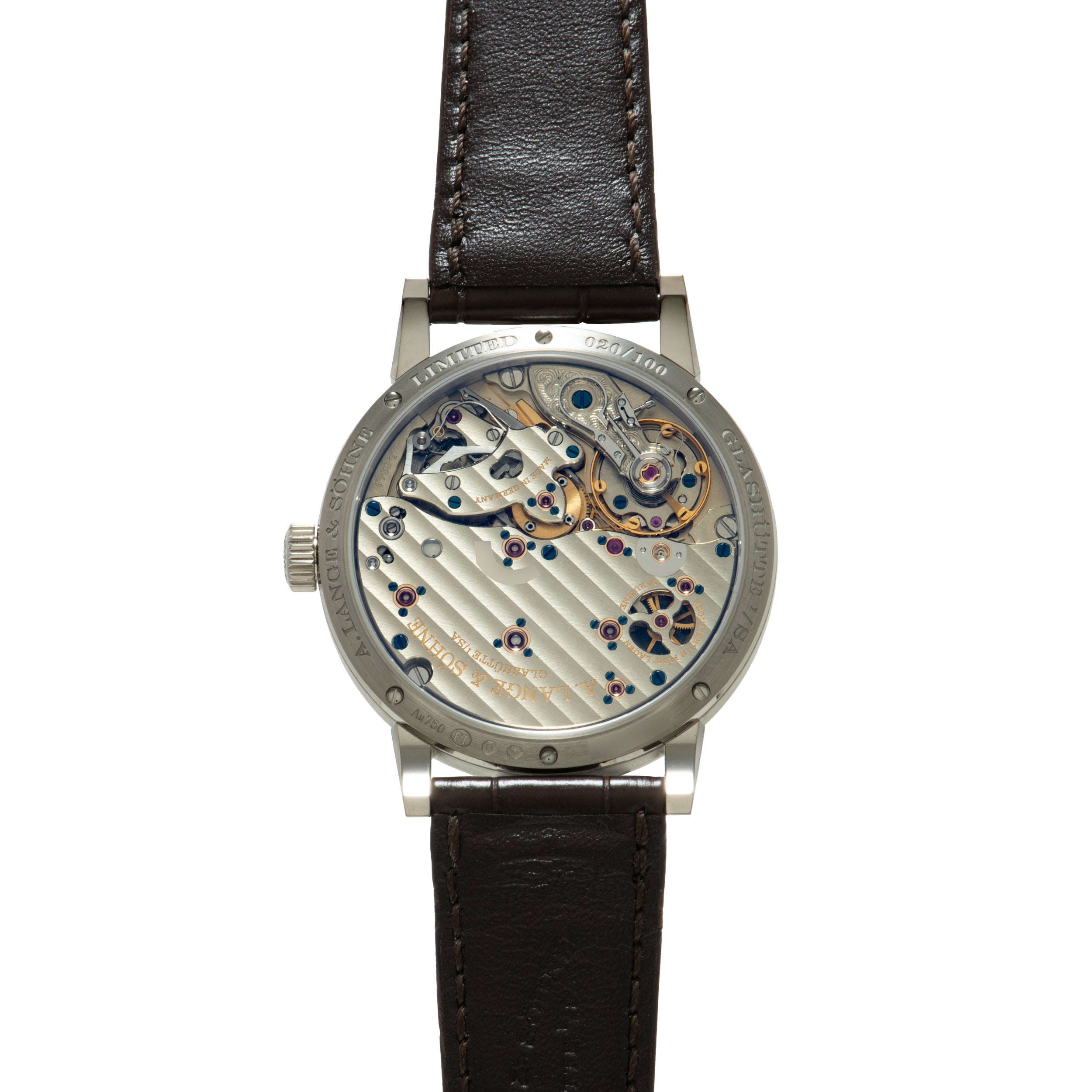 Silver-cased watch with exposed mechanical movement, black leather strap, and visible gears and jewels on dial.