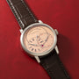 A. Lange & Söhne luxury watch with cream dial, Roman numerals, dual subdials, and black crocodile leather strap.