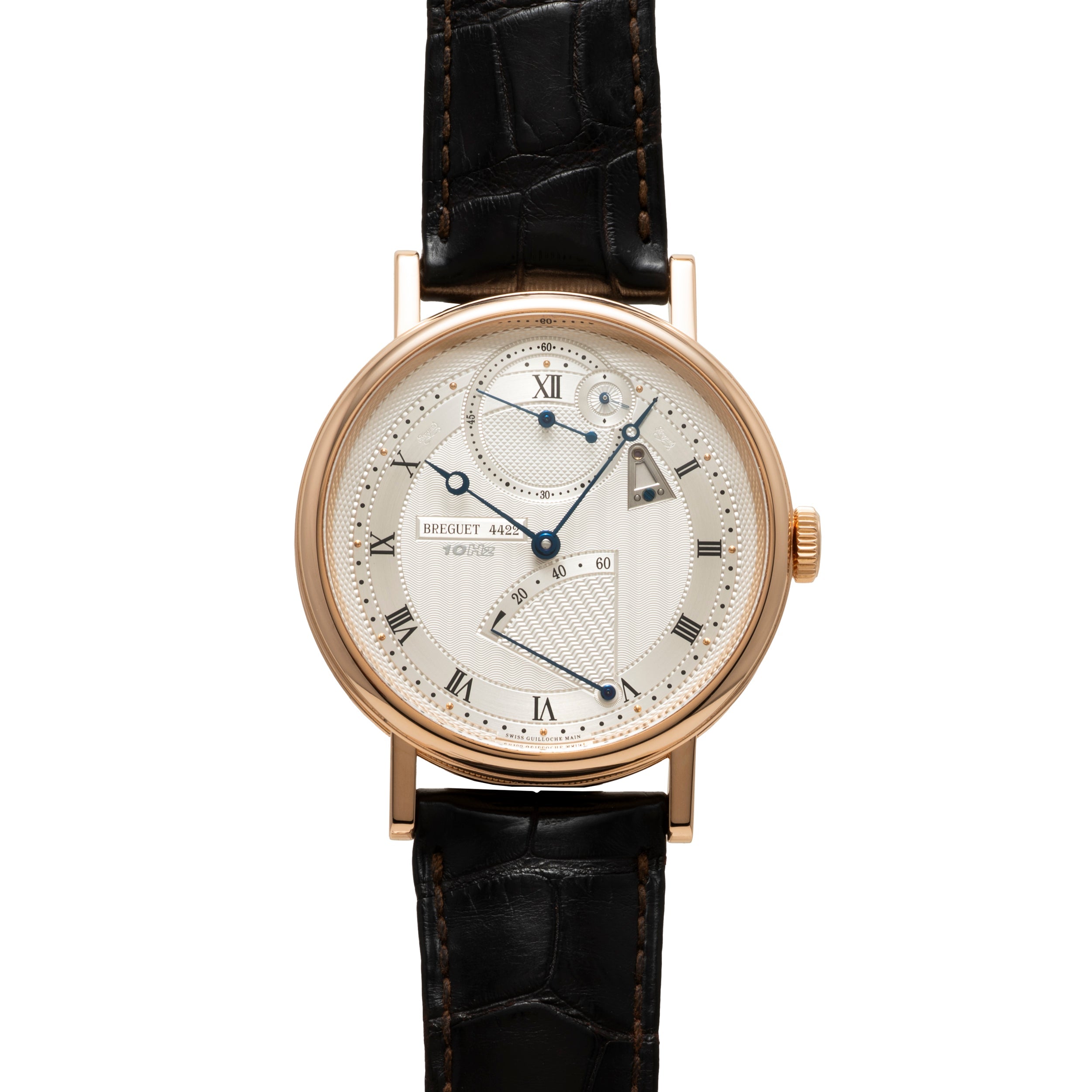 Rose gold round watch with cream dial, Roman numerals, and black crocodile leather strap.