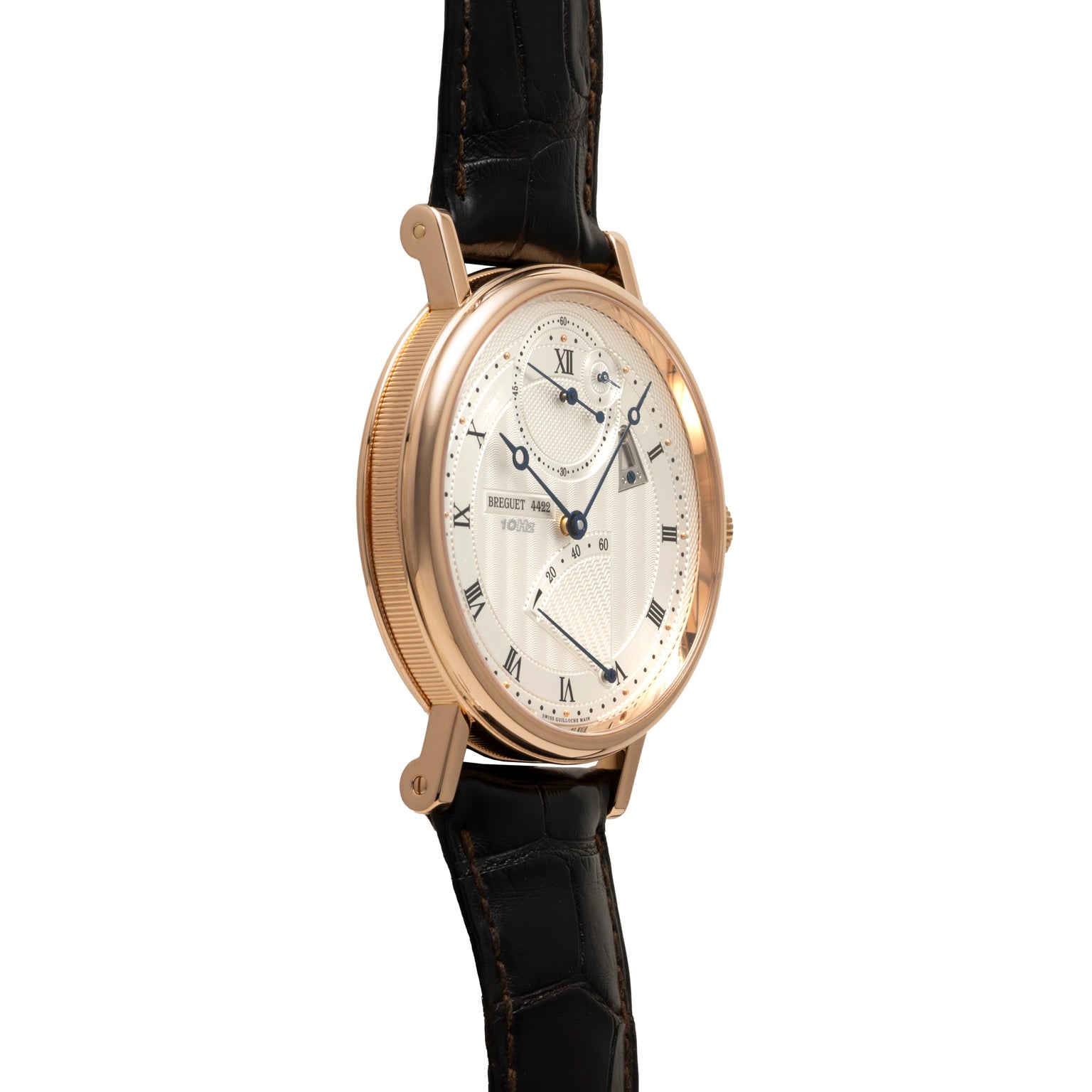Rose gold watch with cream dial, Roman numerals, multiple subdials, and black leather strap.