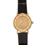 Gold-tone Polerouter watch with champagne dial featuring portrait engraving and Arabic script, black leather strap.