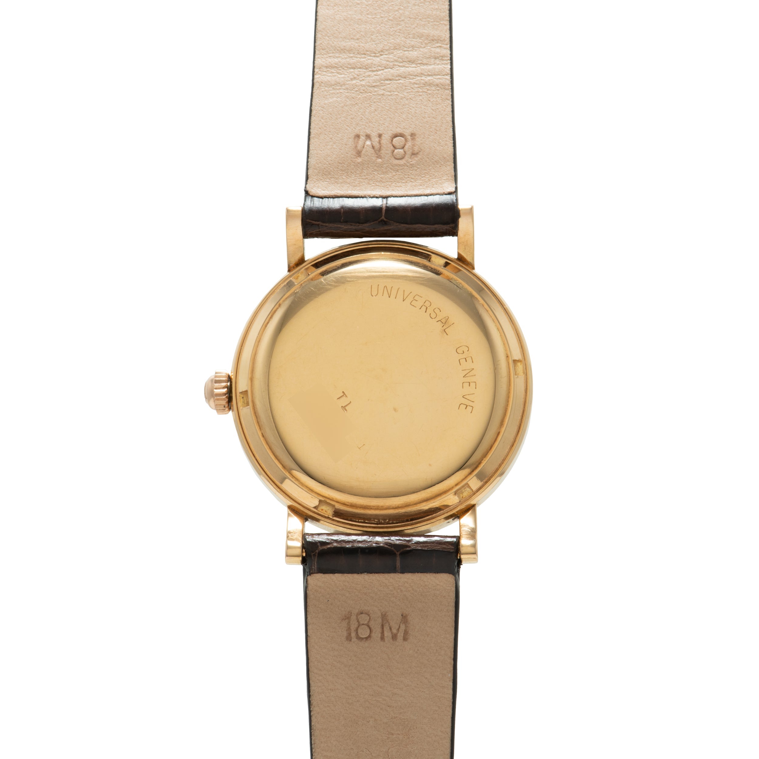 Gold-tone Universal Genève wristwatch with round case, cream dial, and two-tone leather strap.