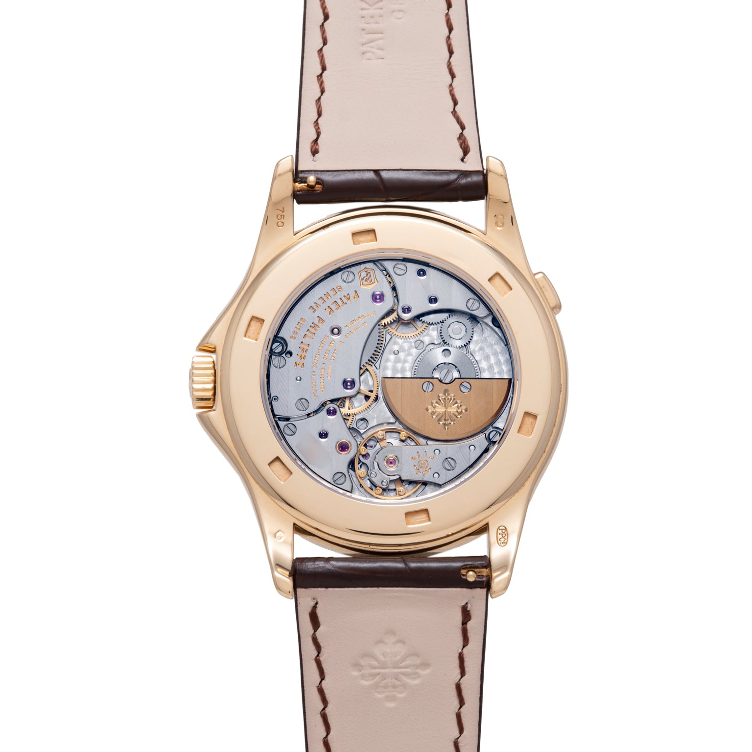 Gold-tone watch with exposed mechanical movement visible through transparent caseback and brown leather strap with stitching.