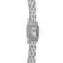Silver-tone rectangular watch with diamond-set bezel, white dial with Roman numerals, and linked metal bracelet.