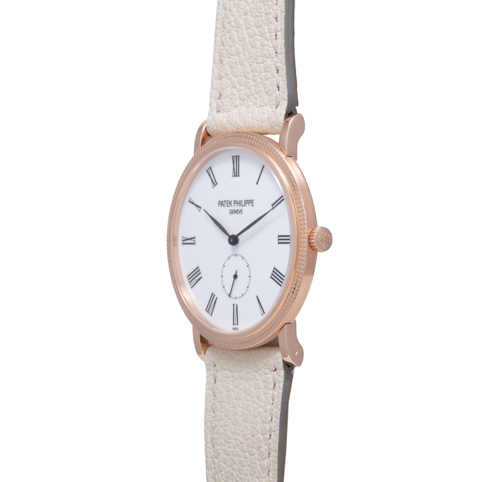 Rose gold oval watch with white dial, Roman numerals, subsidiary seconds dial, and cream leather strap.