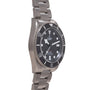 Tudor Pelagos 39 stainless steel watch with black dial, rotating bezel, and metal bracelet.