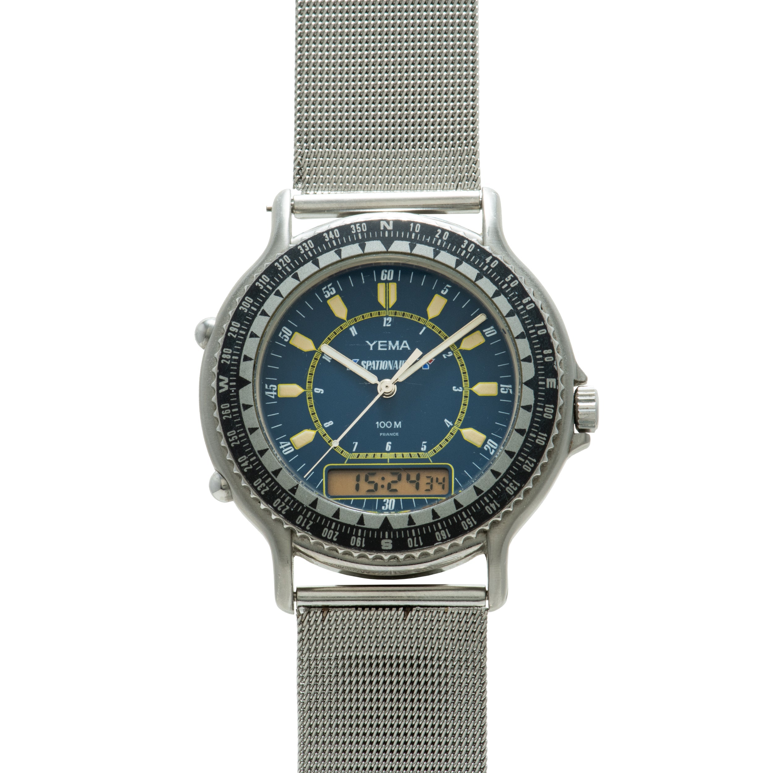 Yema Spationaute ISS watch with dark blue dial, yellow hour markers, rotating bezel, digital display, and stainless steel mes
