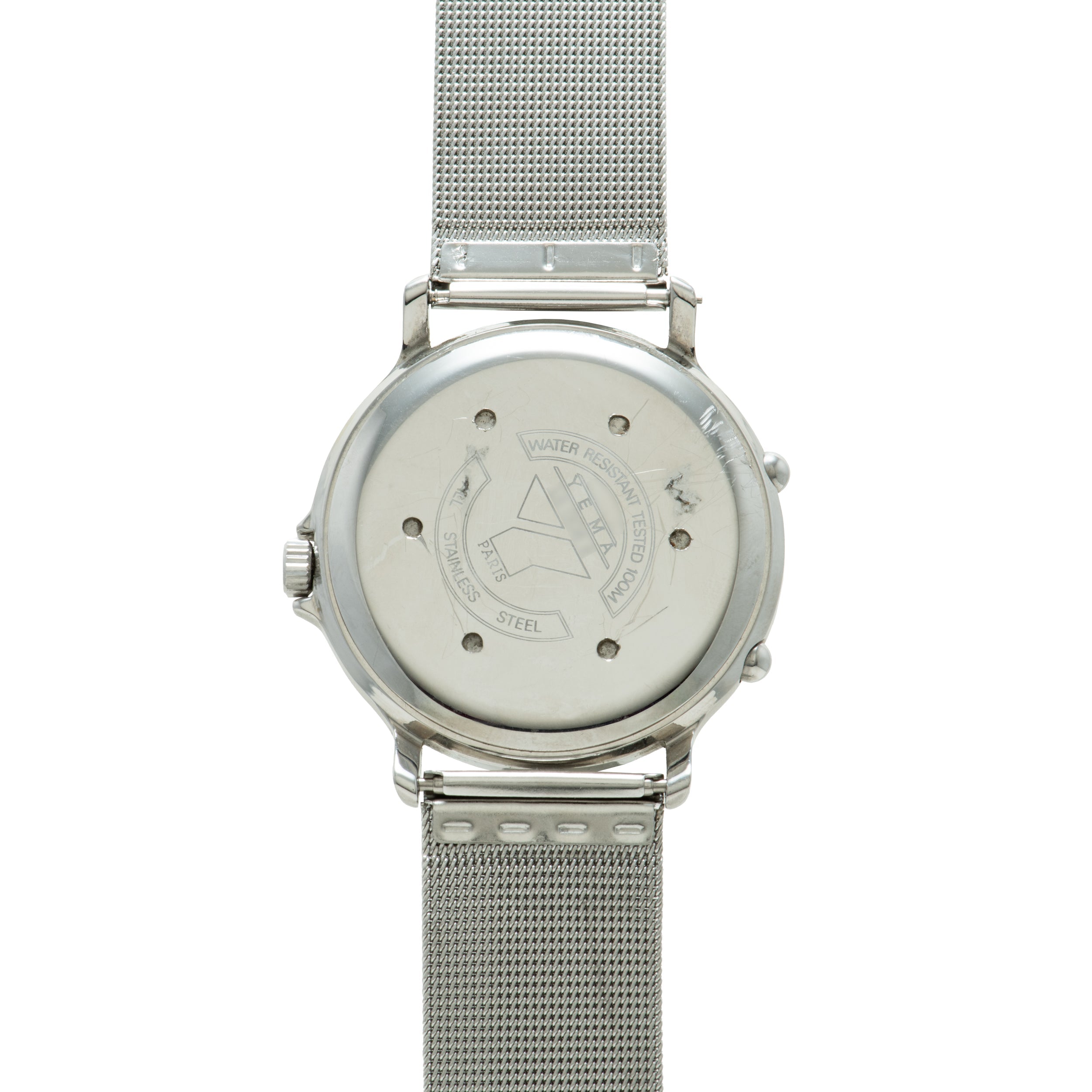 Silver stainless steel watch with mesh band and cream dial showing ISS emblem on caseback.