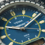 Yema Spationaute ISS watch with blue dial, yellow hour markers, silver hands, and black bezel with tachymeter scale.
