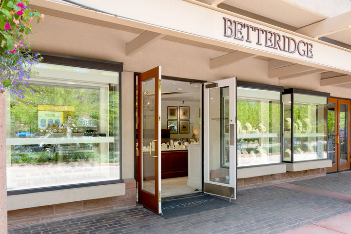 Exterior of Betteridge jewelry store with glass displays and open double doors inviting customers inside.
