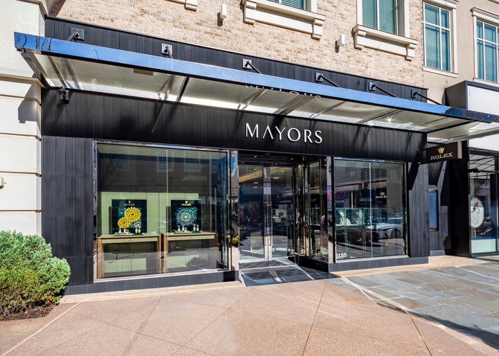 The storefront of Mayors jewelry and watch store with glass windows and displays.