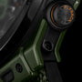 Dark green ceramic watch with black rubber strap and orange accent dial featuring Flyback reset function.