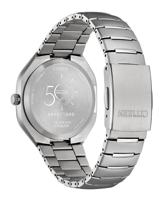 Black titanium watch with rectangular dial, three-link bracelet, and Eco-Drive branding visible on case back.