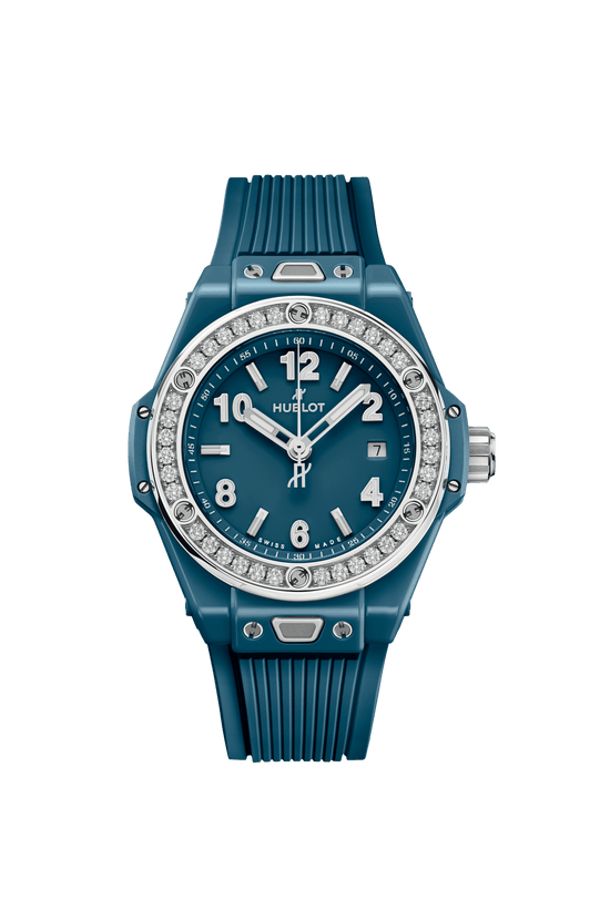 Petrol blue ceramic women's watch with diamond-set bezel, white numerals, and ribbed rubber strap.