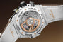 White ceramic Hublot Big Bang chronograph watch with exposed rose gold movement, white leather strap, and multiple subdials.