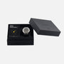 The Braun BN0279 Sub-Seconds Limited Edition For Hodinkee wristwatch and booklet are displayed in a black Braun gift box, with the lid set to the side.