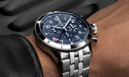A Breitling Classic Avi watch on a wrist