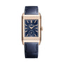 The Jaeger-LeCoultre Polaris Date, a luxury rectangular wristwatch with a blue leather strap, gold case, blue dial with gold markers and hands, plus a small seconds subdial at six o’clock, features the precise Calibre 899 movement.