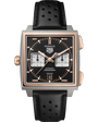 Square stainless steel and rose gold chronograph watch with black dial, white subdials, and black perforated leather strap.