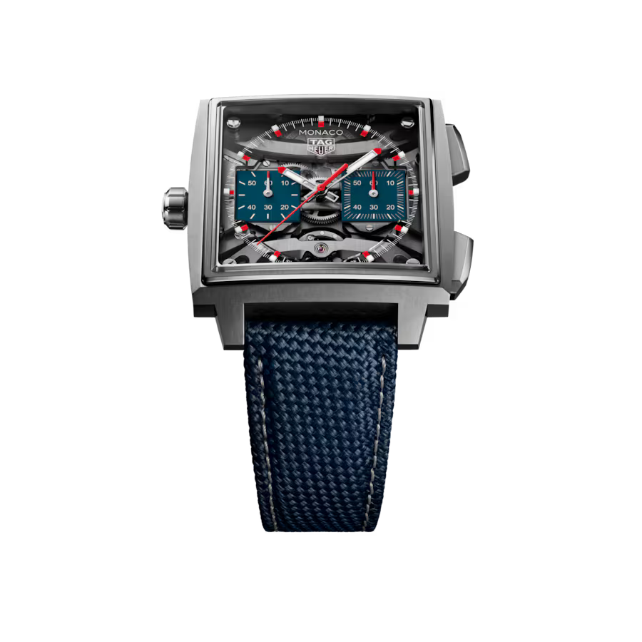 Rectangular stainless steel chronograph watch with black dial, red accents, dual subdials, and dark blue textile strap.