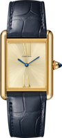 Cartier’s Tank Américaine watch features a square face, blue hands, and a dark blue leather strap.