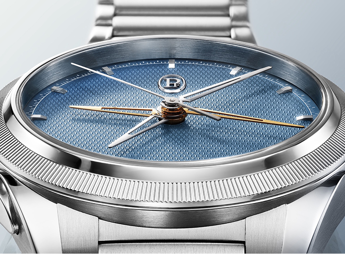 Silver watch with a blue face on a light gray background