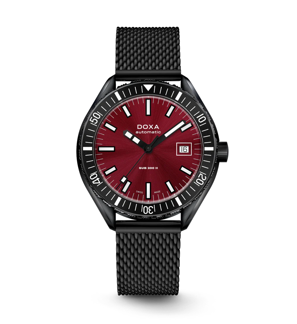 Doxa watch with red dial and black strap on a white background