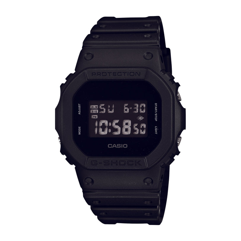 Black Casio G-Shock digital watch with square resin case and band, displaying time and date on LCD screen.